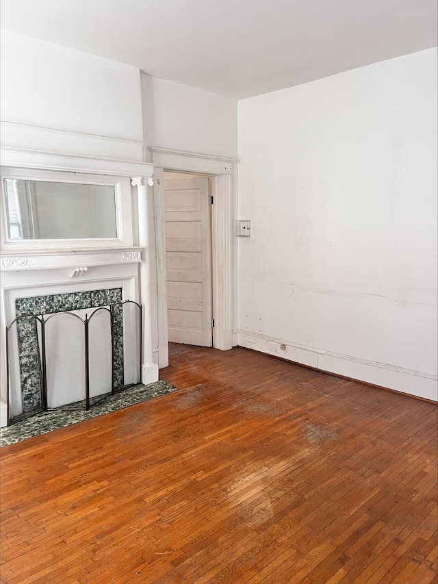 unfurnished living room featuring wood-type flooring