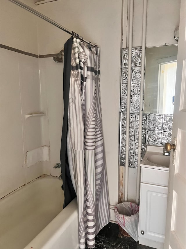 bathroom featuring shower / tub combo and vanity