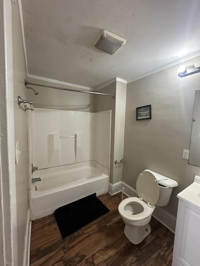 full bathroom featuring toilet, wood-type flooring,  shower combination, vanity, and crown molding