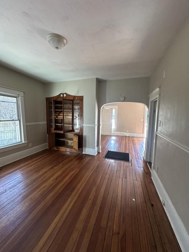 empty room featuring dark hardwood / wood-style floors