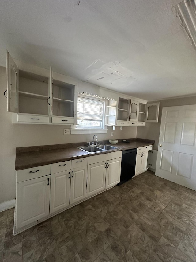 kitchen with sink, white cabinets, and black dishwasher