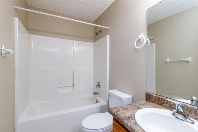 full bathroom featuring toilet, a textured ceiling, bathing tub / shower combination, and vanity