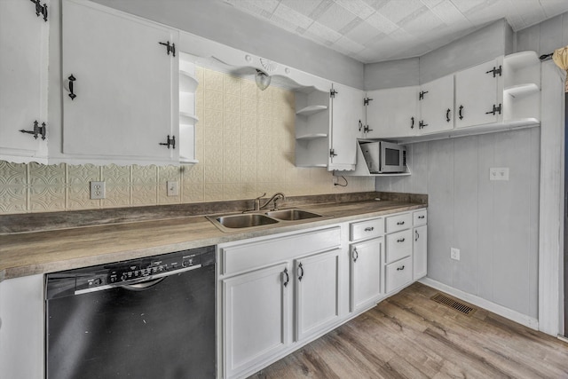 kitchen with dishwasher, light wood-type flooring, sink, white cabinetry, and tasteful backsplash