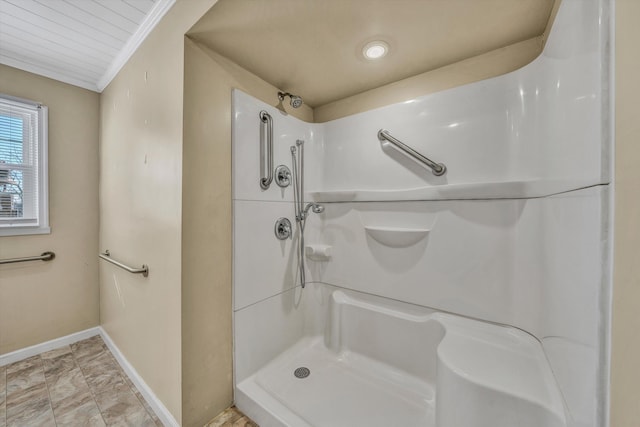 bathroom with ornamental molding and a shower