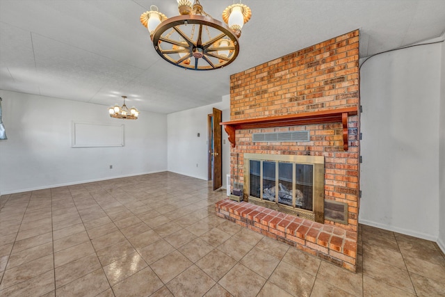 unfurnished living room featuring tile patterned flooring, a brick fireplace, a textured ceiling, and a chandelier