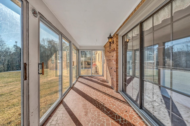 unfurnished sunroom featuring a wealth of natural light