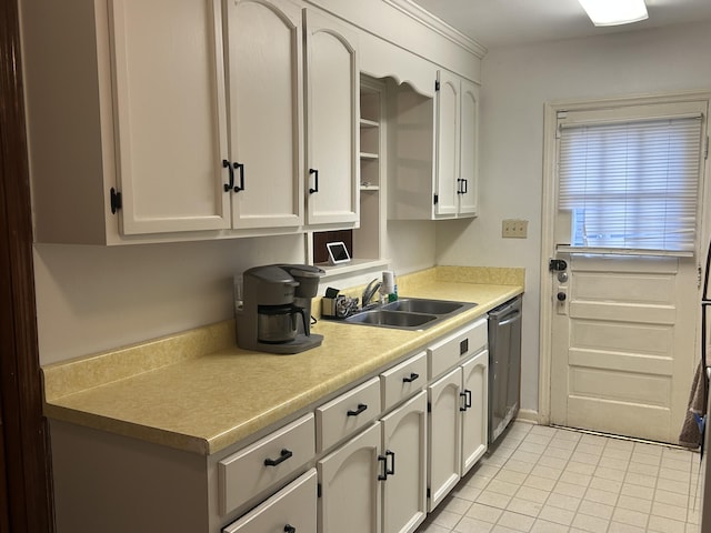 kitchen featuring sink, light tile patterned floors, dishwasher, and white cabinets