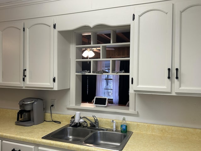 kitchen with sink and white cabinets