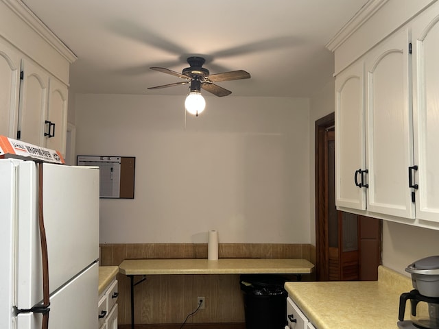 kitchen with ceiling fan, white cabinets, and white refrigerator