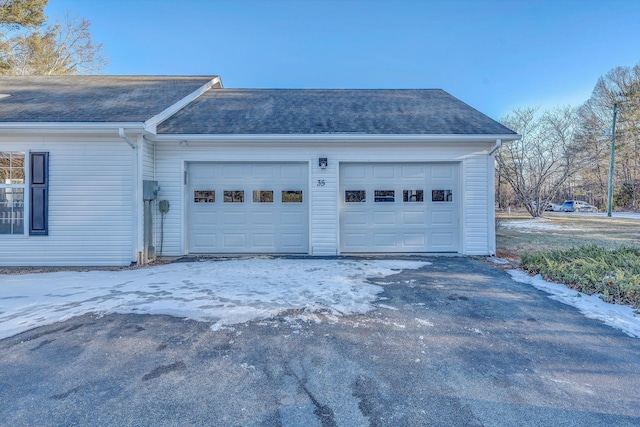 view of snow covered garage