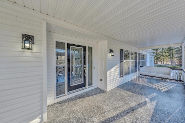 doorway to property featuring a patio area