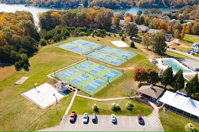 birds eye view of property with a water view