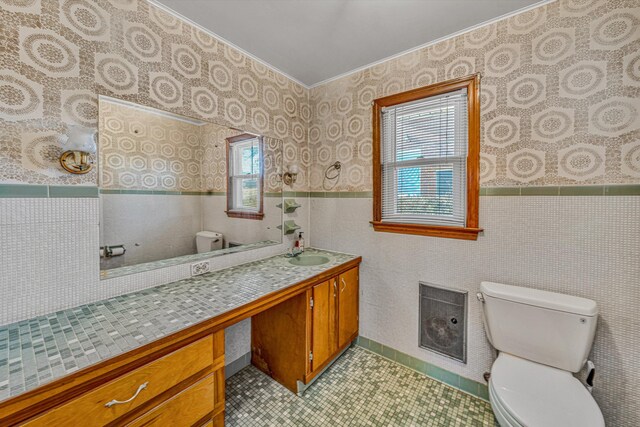 kitchen featuring sink, ornamental molding, and a textured ceiling