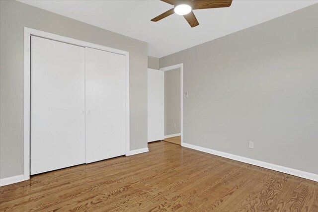 unfurnished sunroom with ceiling fan