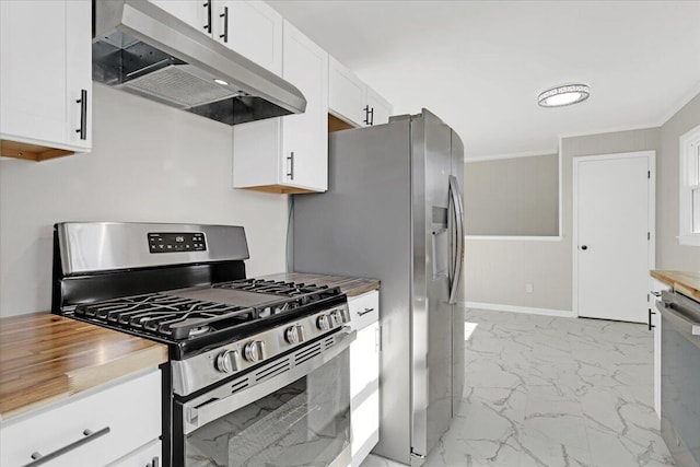 kitchen featuring white cabinetry, butcher block counters, and appliances with stainless steel finishes