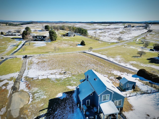 birds eye view of property with a rural view