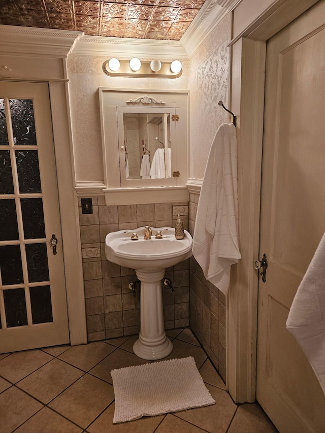 bathroom featuring ornamental molding, tile patterned flooring, and tile walls