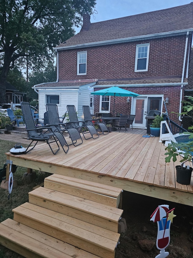 wooden deck with grilling area