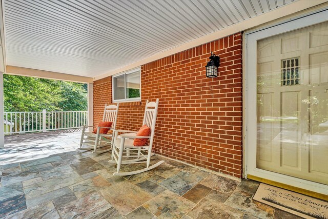 exterior space with a lawn and a carport