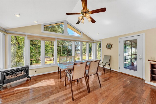 view of yard with a sunroom and a storage unit