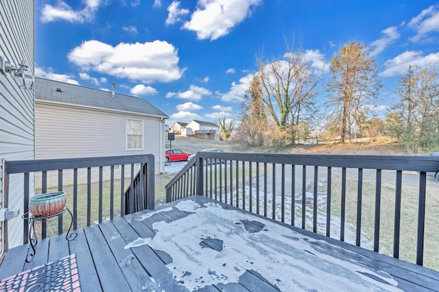 wooden terrace with a lawn