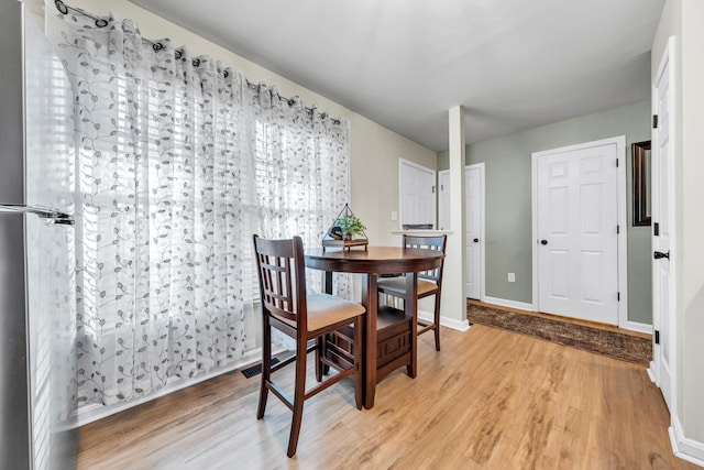 dining room featuring light hardwood / wood-style floors