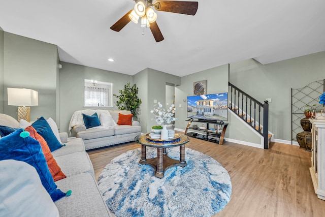 living room with ceiling fan and hardwood / wood-style floors