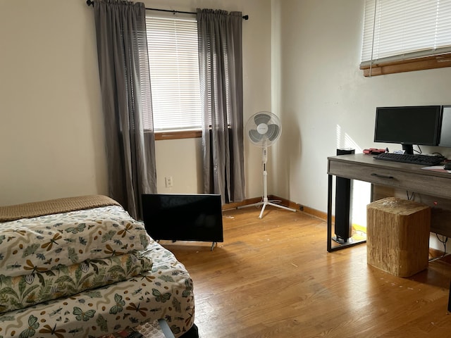 bedroom with light hardwood / wood-style flooring