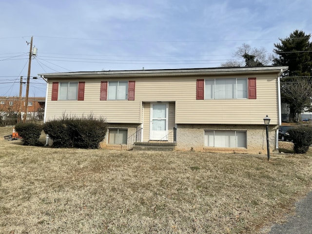 bi-level home with a front yard