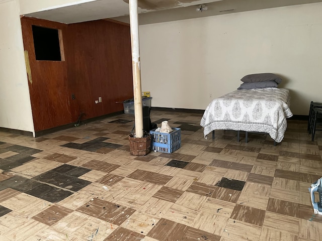 unfurnished bedroom featuring parquet flooring