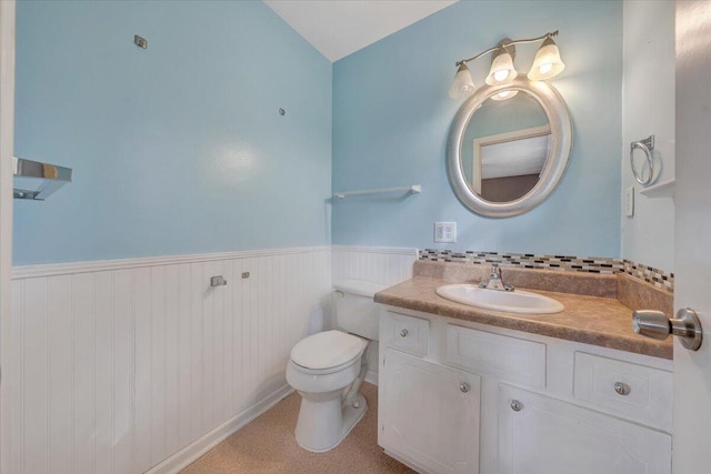 bathroom featuring toilet and vanity