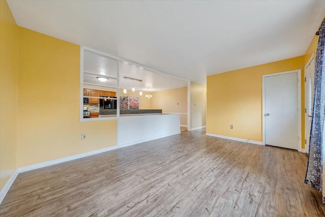 unfurnished living room featuring light hardwood / wood-style floors