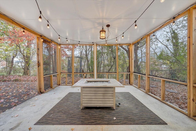 unfurnished sunroom with plenty of natural light