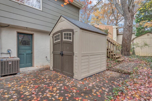 view of outbuilding featuring central AC