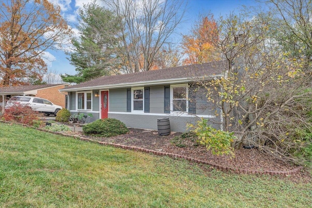 ranch-style house featuring a front lawn