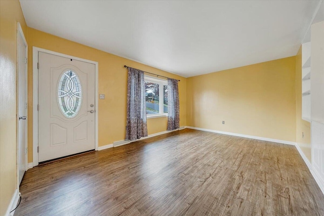 foyer entrance with hardwood / wood-style floors