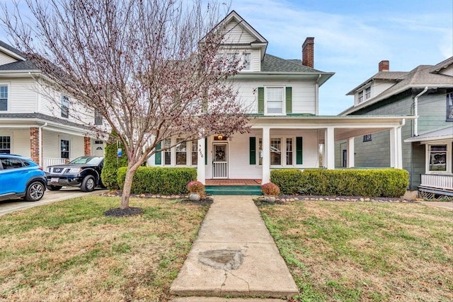 view of front facade with a porch and a front lawn