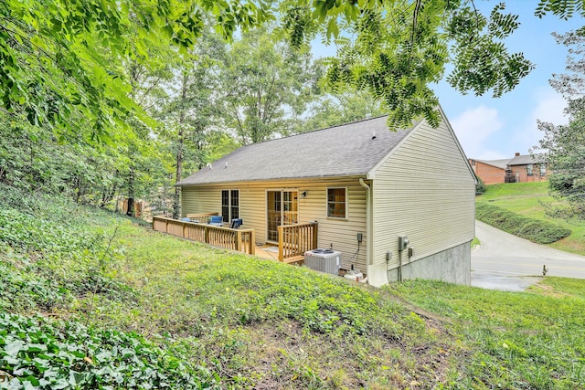 back of property featuring central AC and a wooden deck