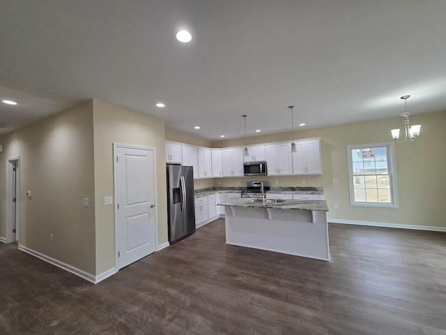 kitchen with stainless steel appliances, recessed lighting, dark wood finished floors, and baseboards