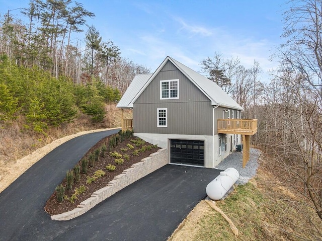 view of side of property featuring a garage