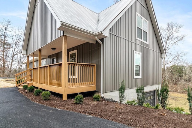 view of property exterior with a porch