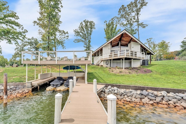 dock area with central AC, a water view, and a lawn