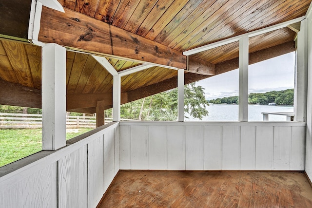 unfurnished sunroom with wood ceiling, a water view, and lofted ceiling with beams