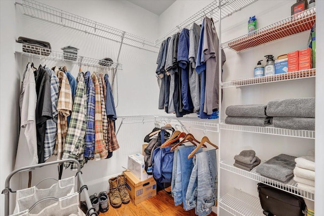 spacious closet with wood finished floors