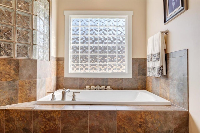 full bathroom featuring plenty of natural light and a bath