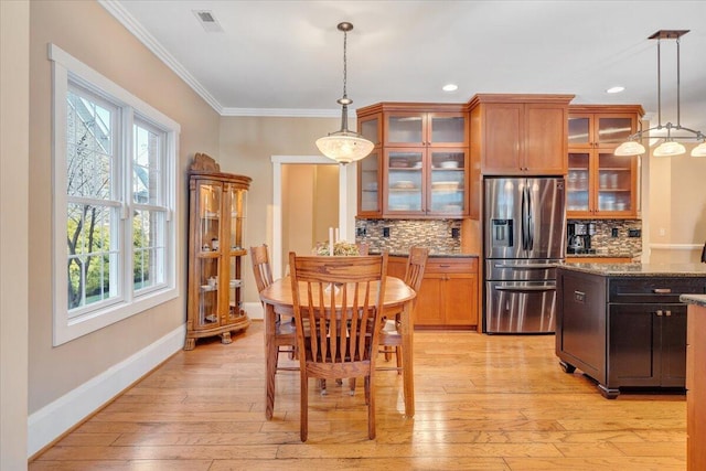 interior space featuring light wood-style flooring, recessed lighting, visible vents, baseboards, and ornamental molding