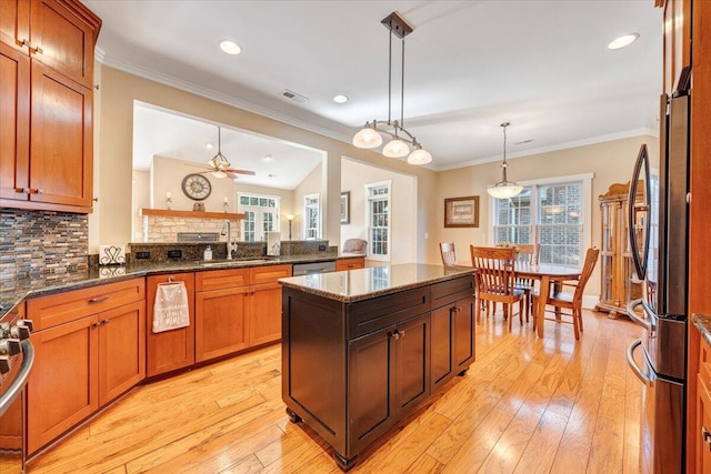 kitchen with stainless steel appliances, a healthy amount of sunlight, visible vents, and a sink