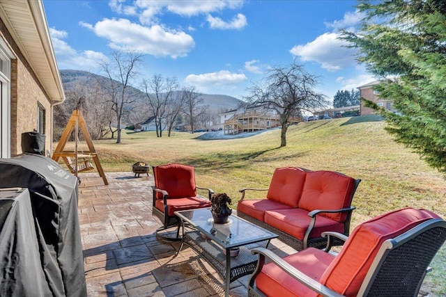 view of patio / terrace featuring a mountain view and an outdoor hangout area