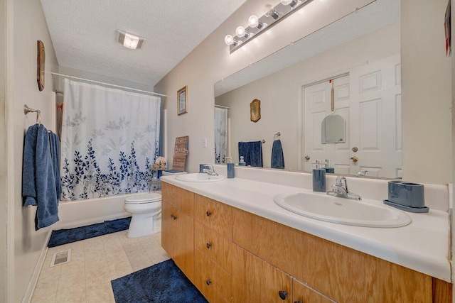 full bathroom featuring toilet, vanity, shower / bath combination with curtain, and a textured ceiling