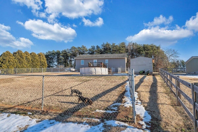 view of front of home featuring a pool